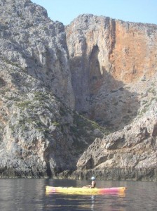 Tall cliffs, small boat